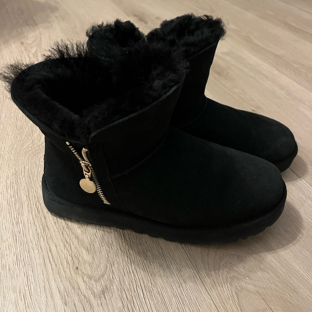 Black uggs with gold zipper